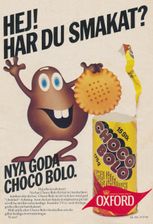 Reklam för chokladkexet Choco Bolo med dess maskot som visar upp kexet