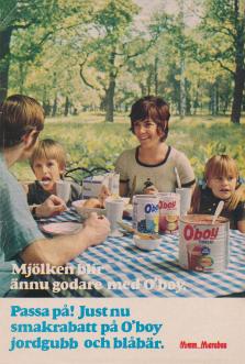 Reklam för chokladdrycken O'boy där en familj sitter vid ett dukat bord - mitt i naturen och dricker O'boy